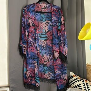 Tropical flower beach cover with fringe.